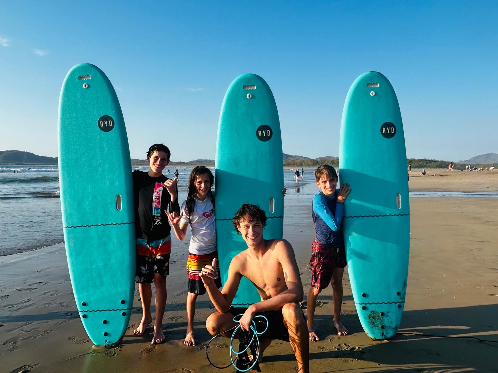 Fresh Surf Lessons group with boards
