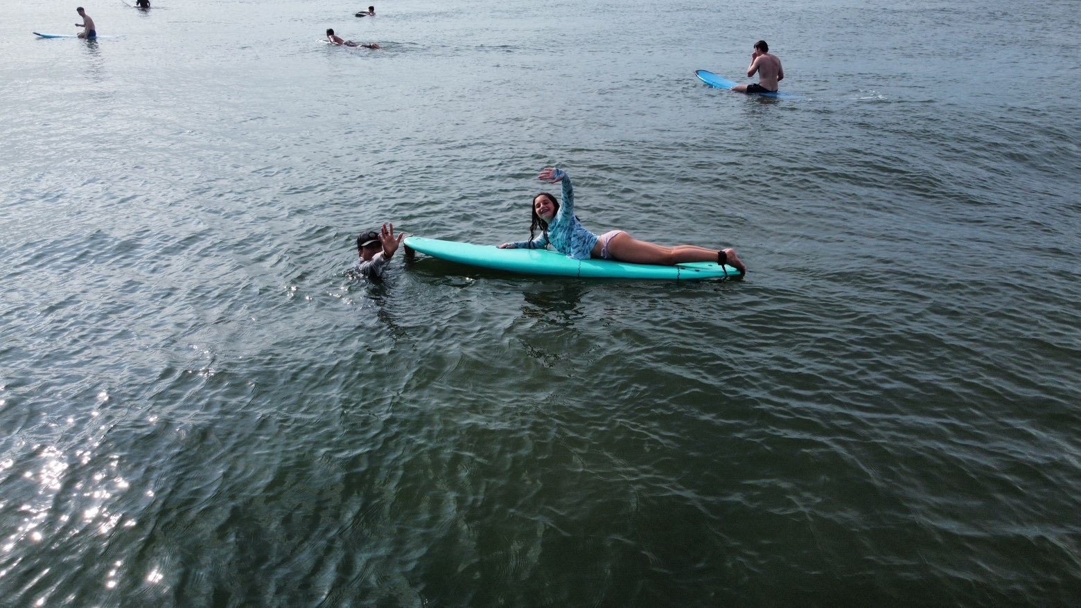 Student enjoying a surf lesson in the water